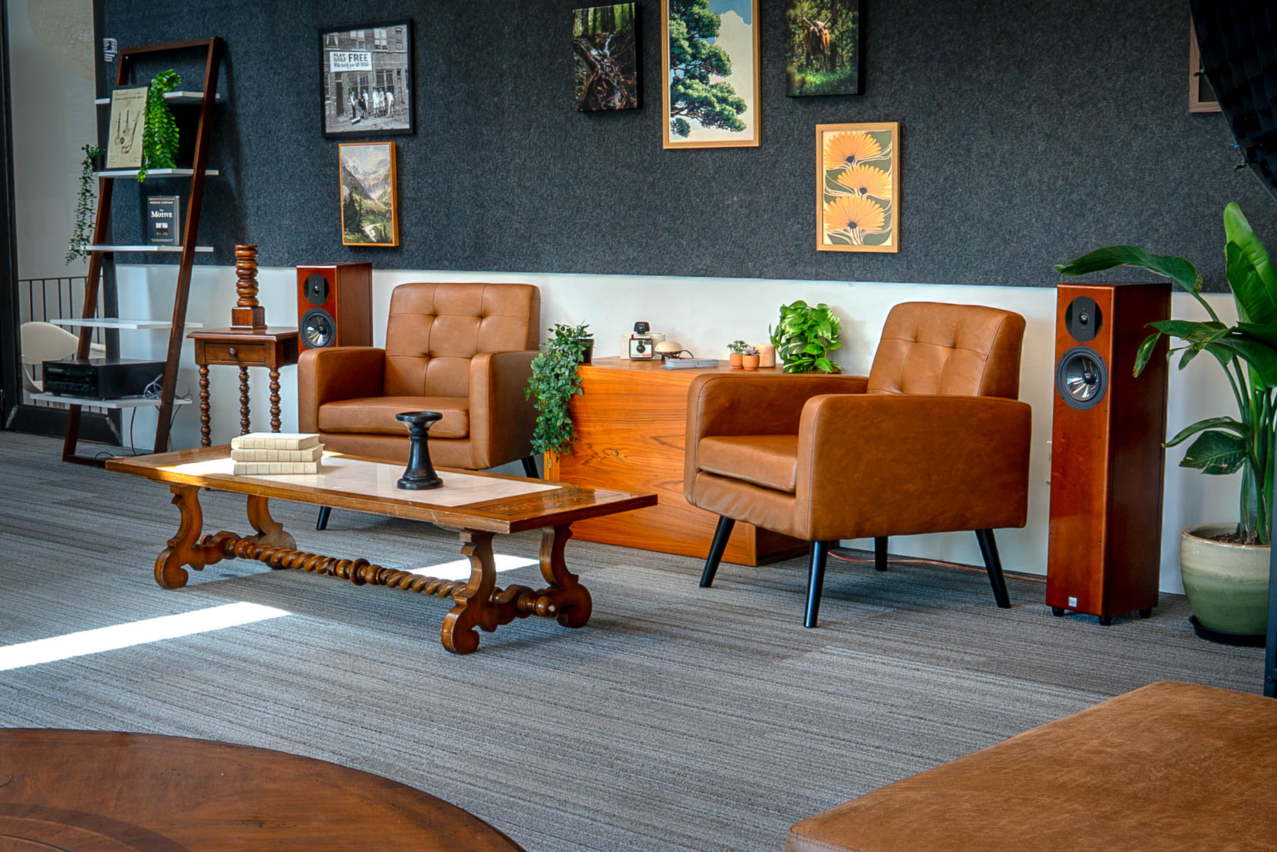 Mid-century leather chairs and gallery wall in the SageContent studio